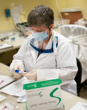 Lab employee prepares a sample for genetic testing