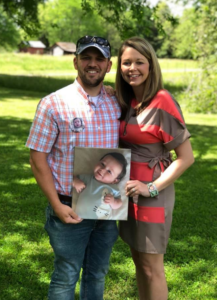 Matt and Melissa Emery holding photo of their late son, Dylan