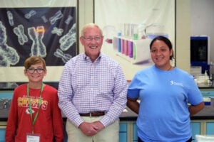 Dr. Curtis Roger in the GGC Education center lab with two camp students