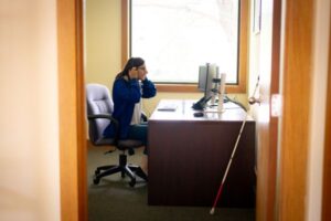 GGC intern, Riley Crawford, prepares to review clinic referrals.